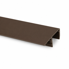 Brown polycarbonate side flashing profile for finishing the edges of multiwall polycarbonate roofing sheets.